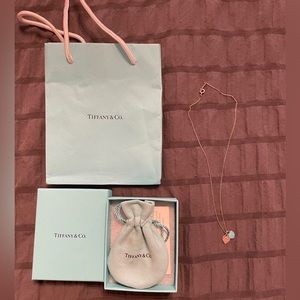 Tiffany heart necklace with box and bags.
